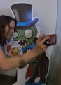 Someone taking a selfie together with a Magician Zombie cardboard cutout